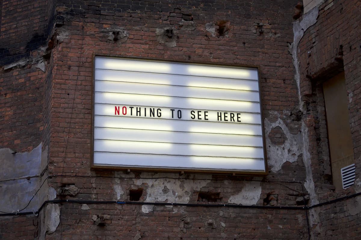 Real weathered marquee reading Nothing to See Here before the demonstration edit